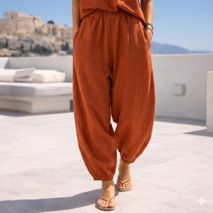 Χειροποίητη Terracotta Barrel Pants από premium modal βισκόζ με ελαστική μέση και σύγχρονη barrel σιλουέτα. Άνετη παντελόνα σε terracotta απόχρωση με χαλαρό όγκο και minimal καλοκαιρινό στυλ.